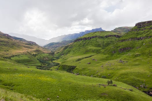 Mountains rock cliffs hills valley summer scenic rural landscape.