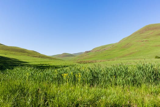 Mountains farmlands scenic valley plateau landscape late summer afternoon landscape..