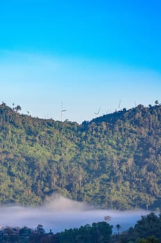 Wind turbine at the mountain and the mist.