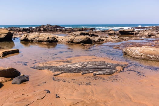 Beach Rocky ocean coastline tidal water pools closeup nature landscape..