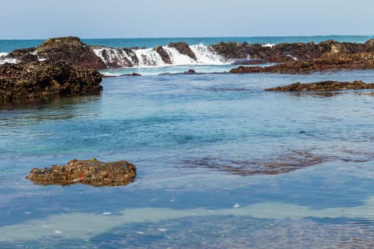 Beach Rocky ocean coastline tidal water pools closeup nature landscape..