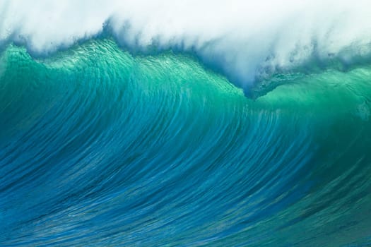 Ocean waves crashing water power towards beach from weather storms.