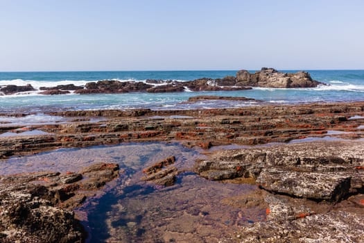 Beach Rocky ocean coastline tidal water pools closeup nature landscape..