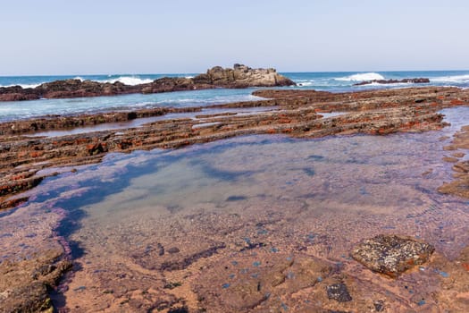 Beach Rocky ocean coastline tidal water pools closeup nature landscape..