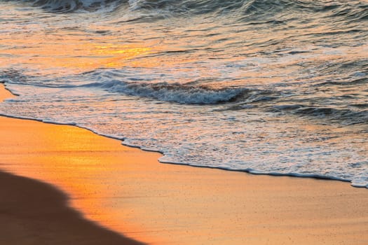 Beach sands waterline shoreline sunrise color mirror sunlight reflections of ocean water nature