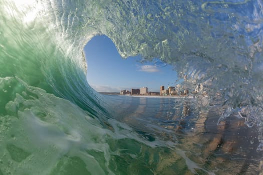 Wave ocean swimming encounter wall of water crashing breaking beauty nature power back-light closeup photo. .