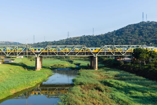Railway bridge closeup steel tracks structure river crossing city countryside route.