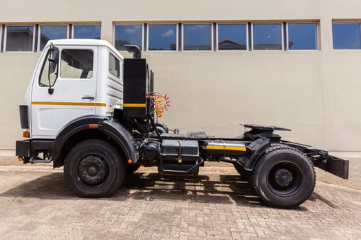 Truck vehicle horse without large cargo trailer parked closeup yard..