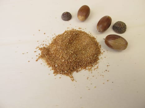 Acorn flour and acorns on a wooden board