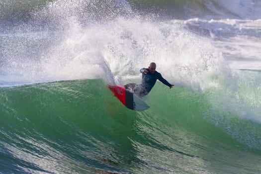 Surfing surfer closeup wave action water photo.