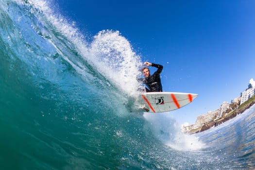 Surfing surfer closeup wave action water photo.