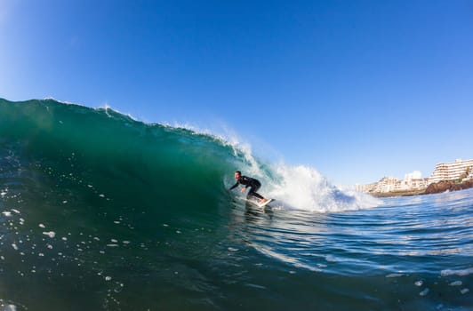 Surfing surfer closeup wave action water photo.