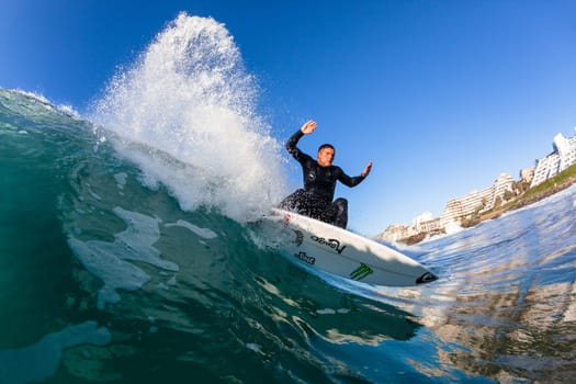 Surfing surfer closeup wave action water photo.