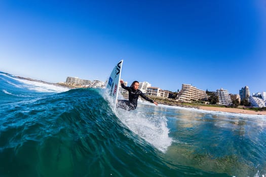 Girl Surfing surfer wave closeup water swimming action photo.