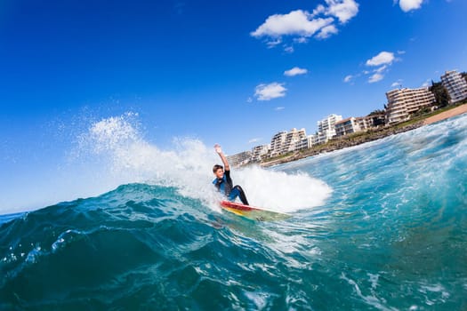 Surfing surfer closeup wave action water photo.