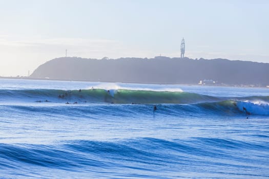 Surfing surfers waiting catching morning ocean large waves lifestyle landscape.