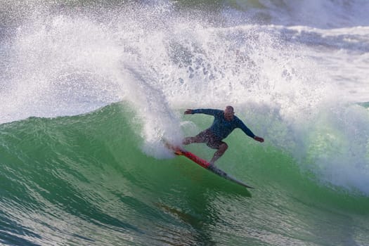 Surfing surfer closeup wave action water photo.