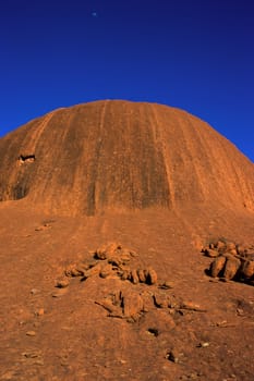 Sandstone boulders at the eastern side of Uluru (Ayers Rock), at early morning as seen along the base of the large monolith, Uluru-Kata Tjuta National Park , Northern Territory, Australia