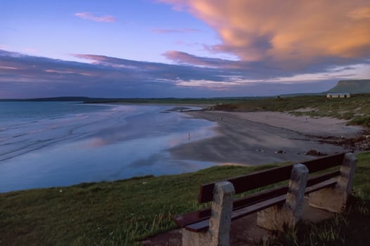People on the beach and in the sea at Rosses Point with Ben Bulben in the background, County Sligo, Ireland