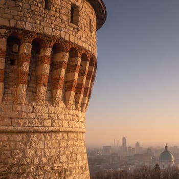 A view of Brescia from the Medieval Castle, with the dome of the Cathedral and the skyscrapers of the modern city, at sunset