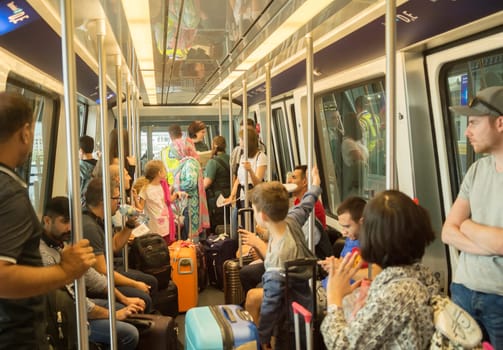 FRANKFURT, GERMANY - AUGUST 29, 2018: People traveling inside train between terminals in Frankfurt airport