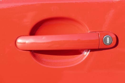 Red door lock on a red car