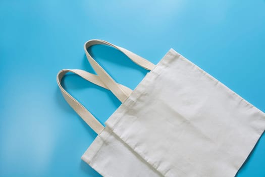 White tote bag canvas fabric. Cloth shopping sack mockup with copy space.