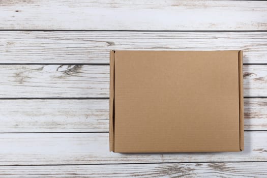 plain cardboard box on a wooden background