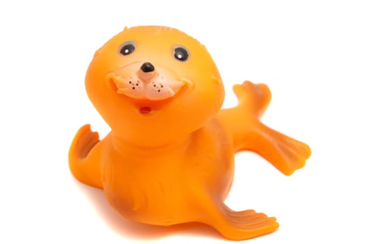 smiling seal toy on a white background
