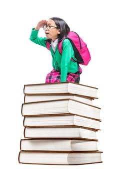 Asian cute girl with glasses and backpack sitting on the pile of books isolated over white background. Back to School concept