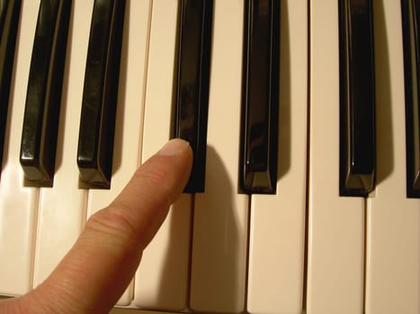Musician is playing on a keyboard