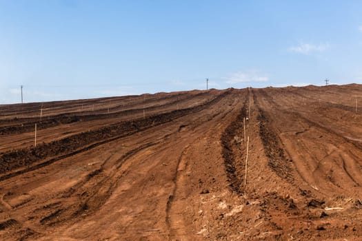 Farm field closeup tractor plowed earth soil detail agriculture background