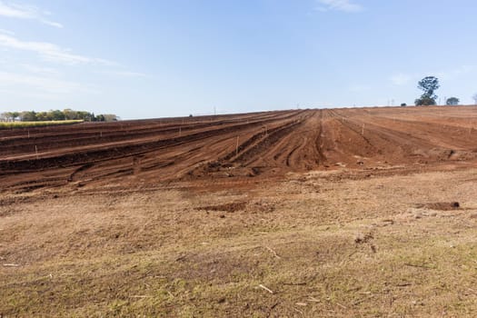 Farm field closeup tractor plowed earth soil detail agriculture background