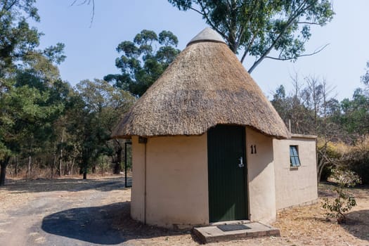 African style thatch grass  roofs round bungalow cottages buildings  holiday camps in rural mountains.