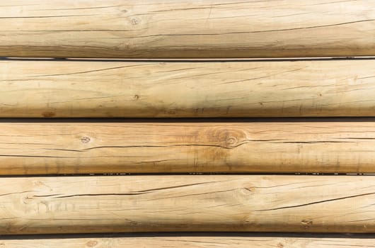 Wood poles low boundary fence wall decor outdoors closeup photo against blue sky