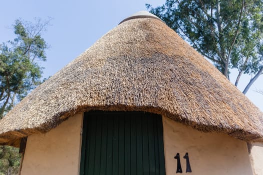 African style thatch grass  roofs round bungalow cottages buildings  holiday camps in rural mountains.