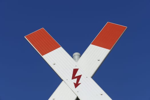 Danger sign St. Andrew's Cross in front of a railroad crossing