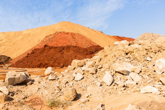 Earth sand mounds embankments of soil colors on industrial project construction landscape