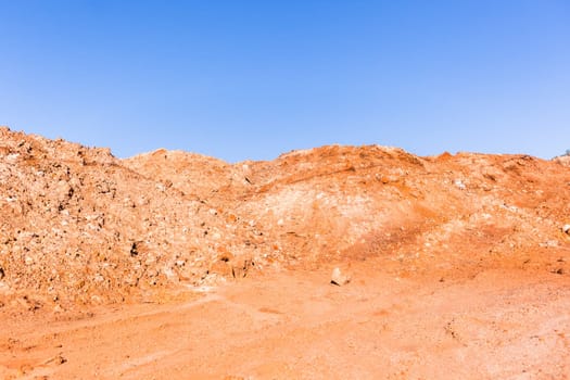 Earth sand mounds embankments of soil colors on industrial project construction landscape