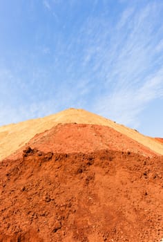Earth sand mounds embankments of soil colors on industrial project construction landscape