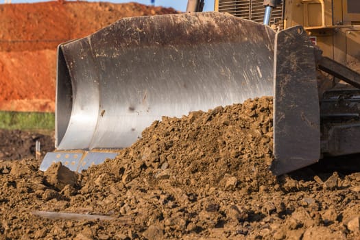 Construction industrial earthworks site  landfill grader dozer machine  leveling sand stones landscape