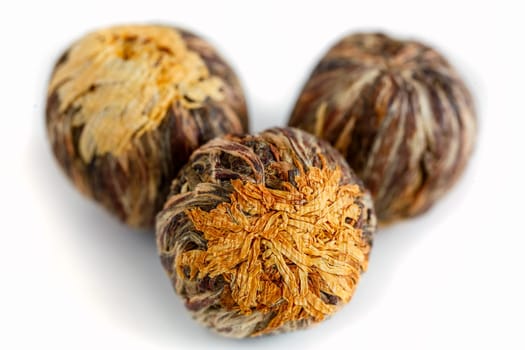 Chinese tea in the shape of a flower, handmade knitted flower and petals of tea, dissolved when brewing