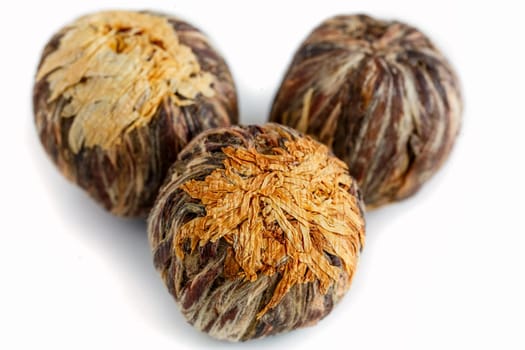 Chinese tea in the shape of a flower, handmade knitted flower and petals of tea, dissolved when brewing