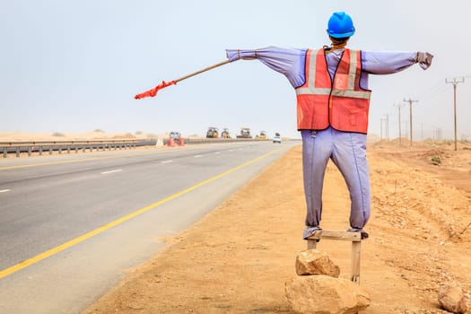 Manequin of a worker used at road construction sites in Oman