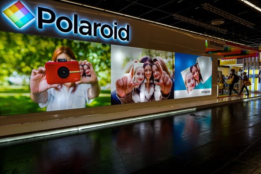 COLOGNE, GERMANY - SEPTEMBER 22, 2016: Photokina Exhibition interior. The Photokina is the world's largest trade fair for the photographic and imaging industries. Polaroid stand in the Photokina Exhibition.