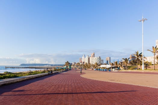 Beach Ocean Promenade Durban South-Africa Photo of beach front promenade ocean waves surfers piers cycling people lifestyle landscape.