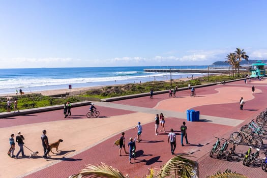Beach Ocean Promenade Durban South-Africa Photo of beach front promenade ocean waves surfers piers cycling people lifestyle landscape.