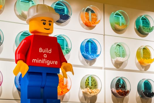 Bologna, Italy, 16 Feb 2019 - Lego store minifigure and various Lego bricks self service containers