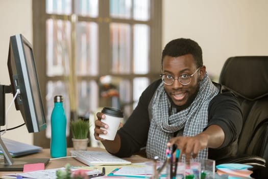 Handsome professional man in a creative office