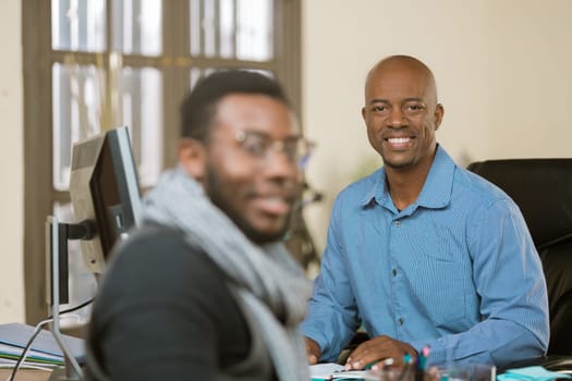 Smiling African American man with client or coleague